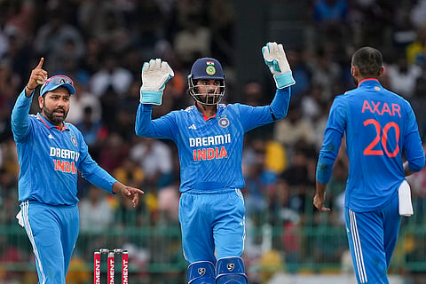 Axar Patel celebrates with Rohit Sharma and KL Rahul after taking the wicket of Janith Liyanage